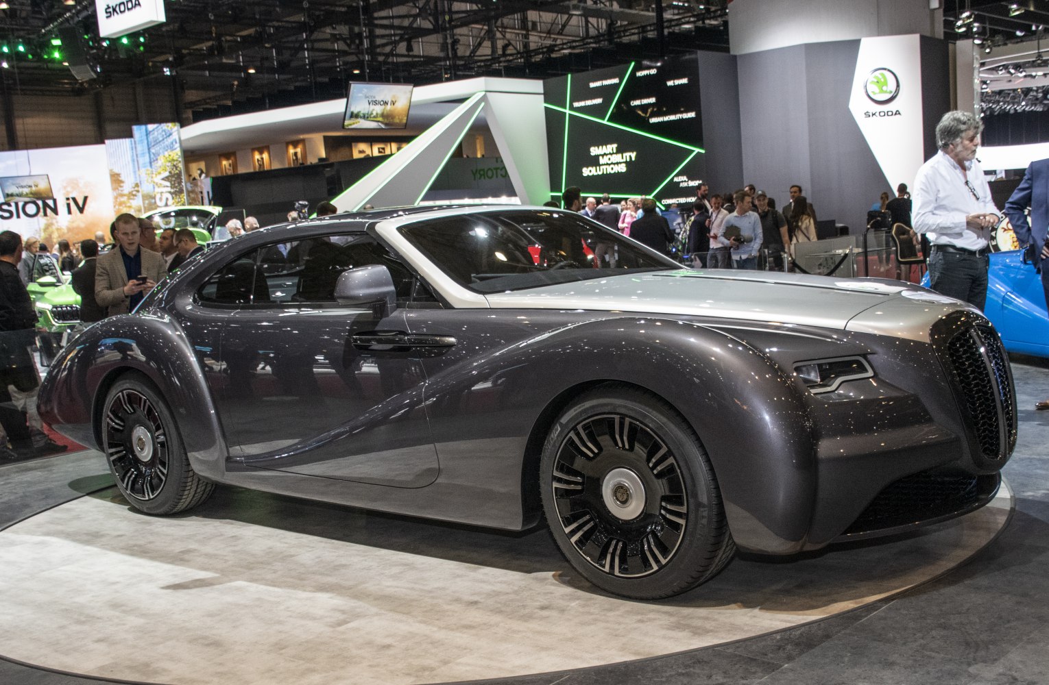 Luxury retro-futuristic coupe with distinctive large rounded fenders and bold grille