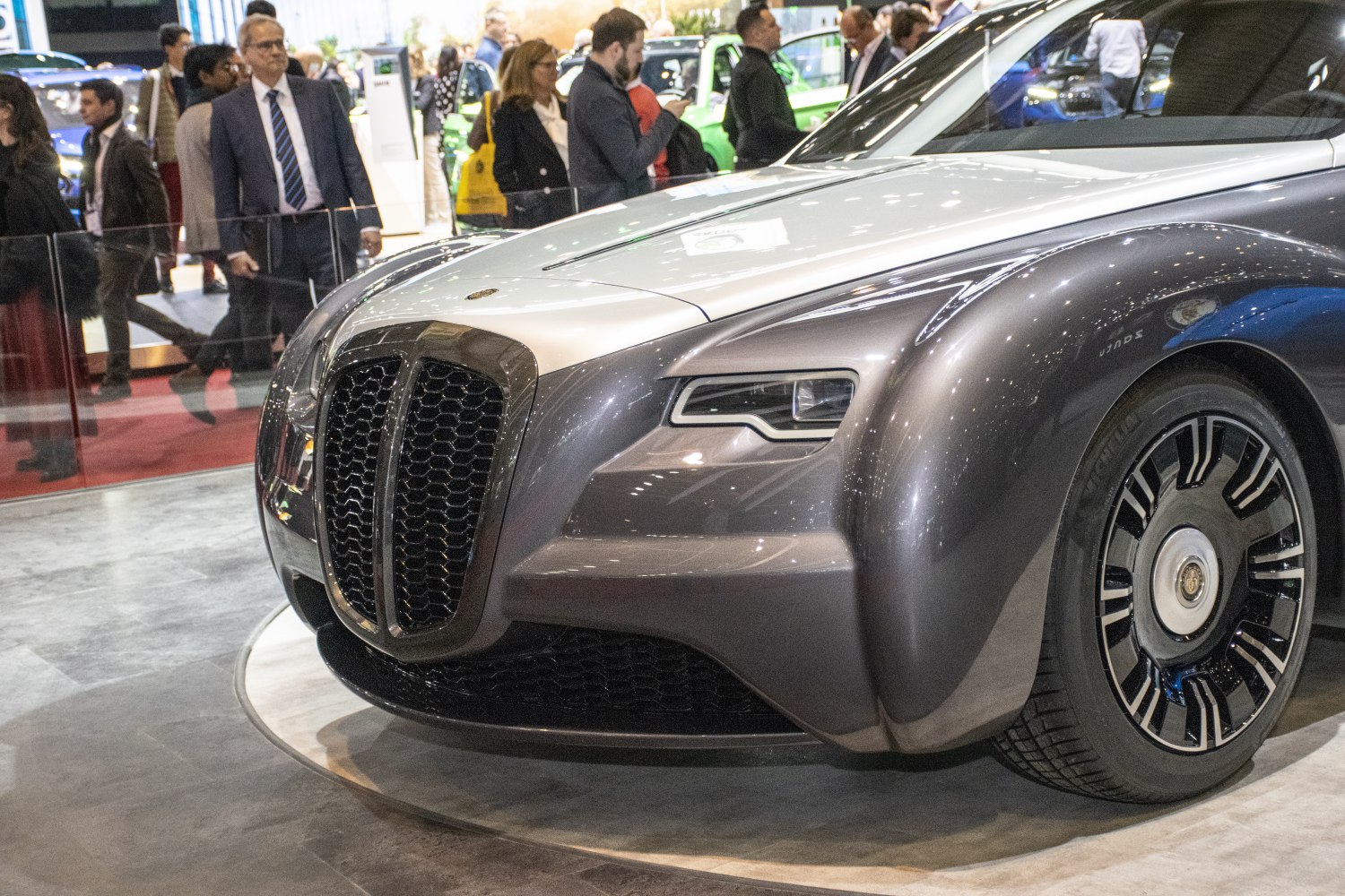 Front grille, sleek headlight, aerodynamic curves, detailed wheel design