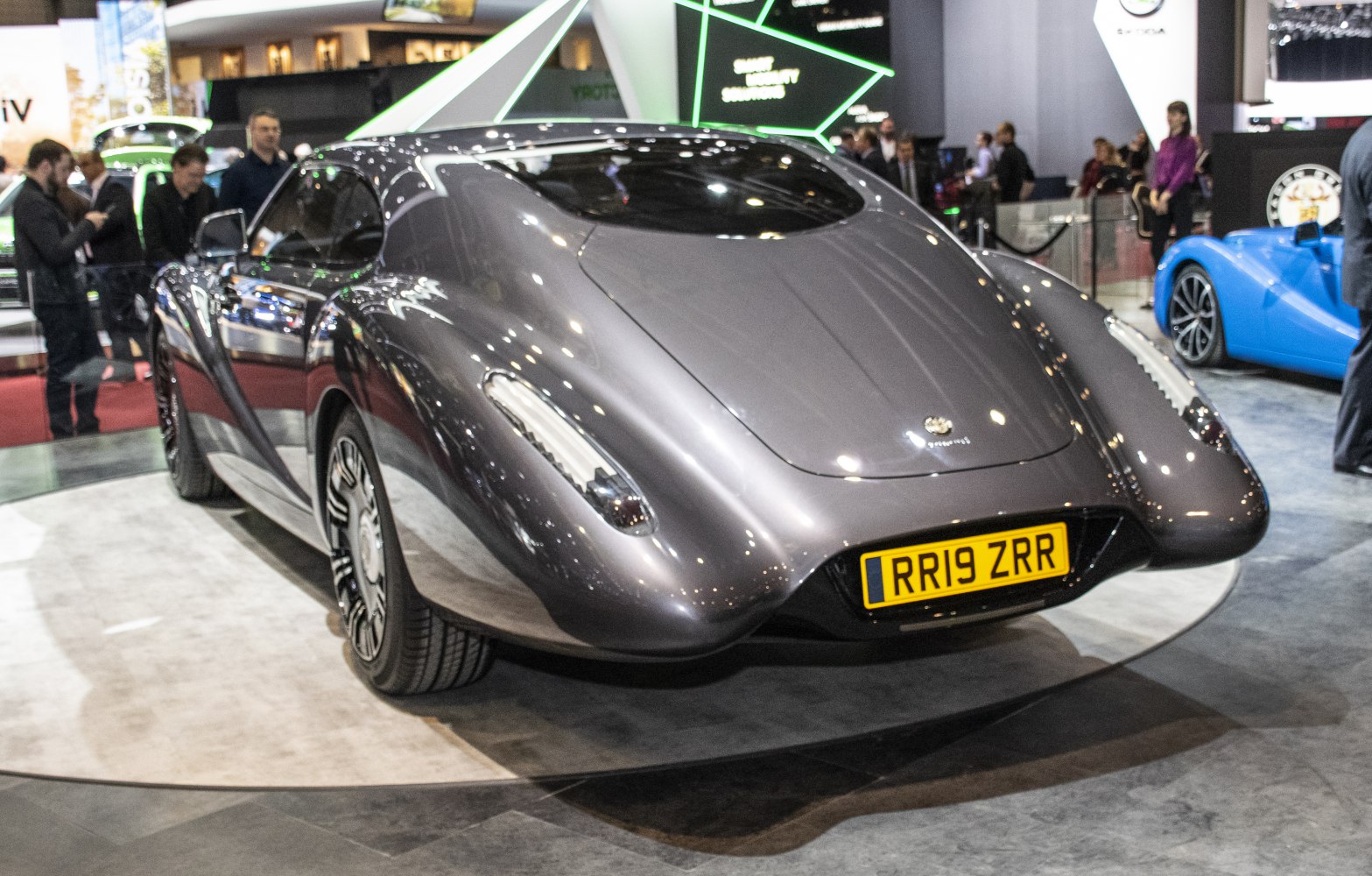 Sleek rear view with flowing aerodynamic curves and integrated slim tail lights.