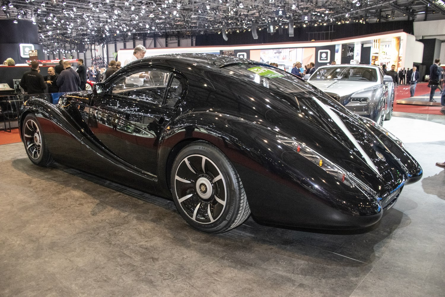 Streamlined retro-style coupe with modern alloy wheels