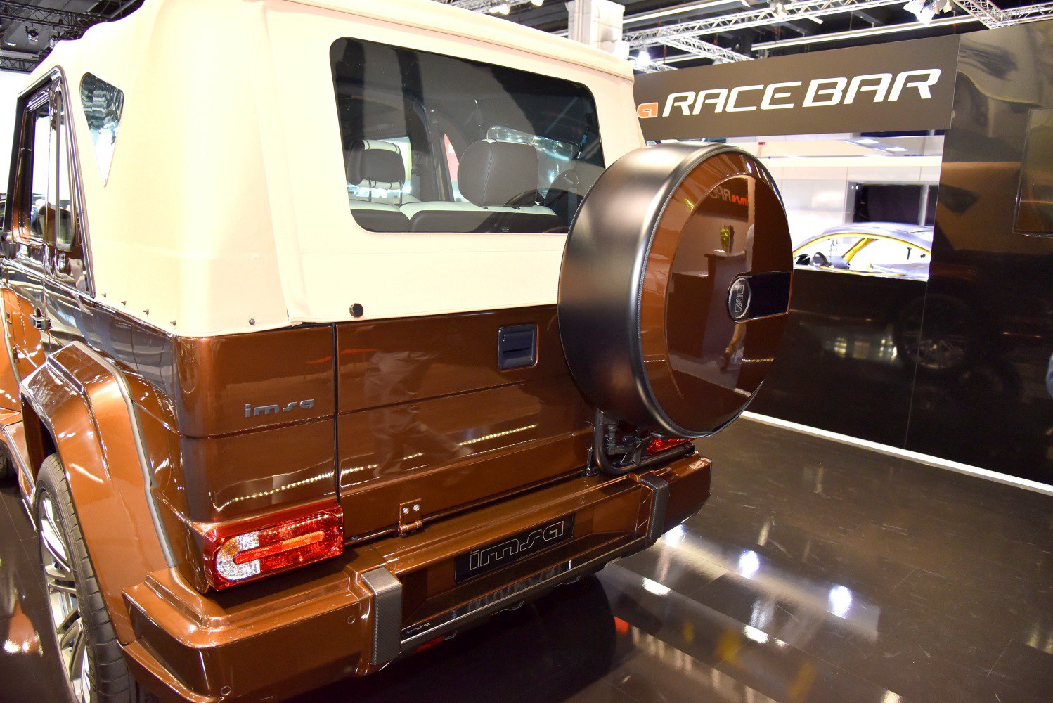 Rear view of SUV with soft fabric top and spare wheel cover