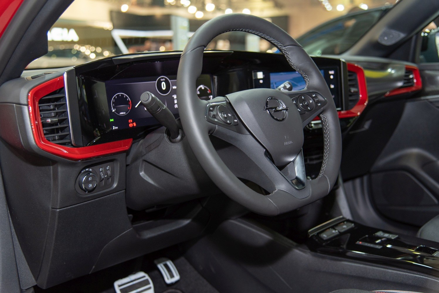 Digital dashboard and multifunction steering wheel with red trim accents
