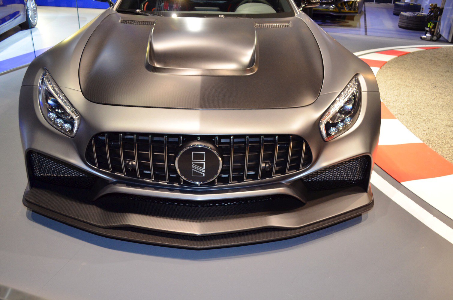 Aggressive front grille and dual LED headlights with aerodynamic hood scoop