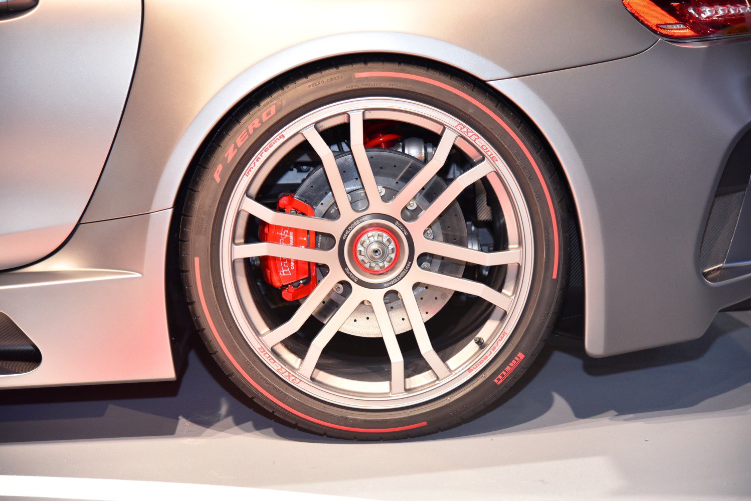 Racing wheel with red brake caliper and Pirelli P Zero tire