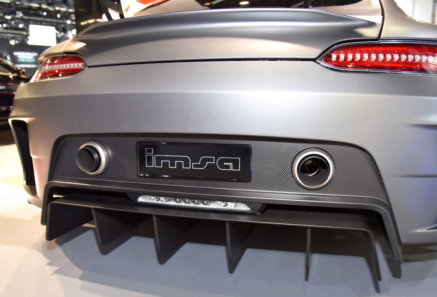 Rear diffuser with dual exhaust outlets and sleek taillights