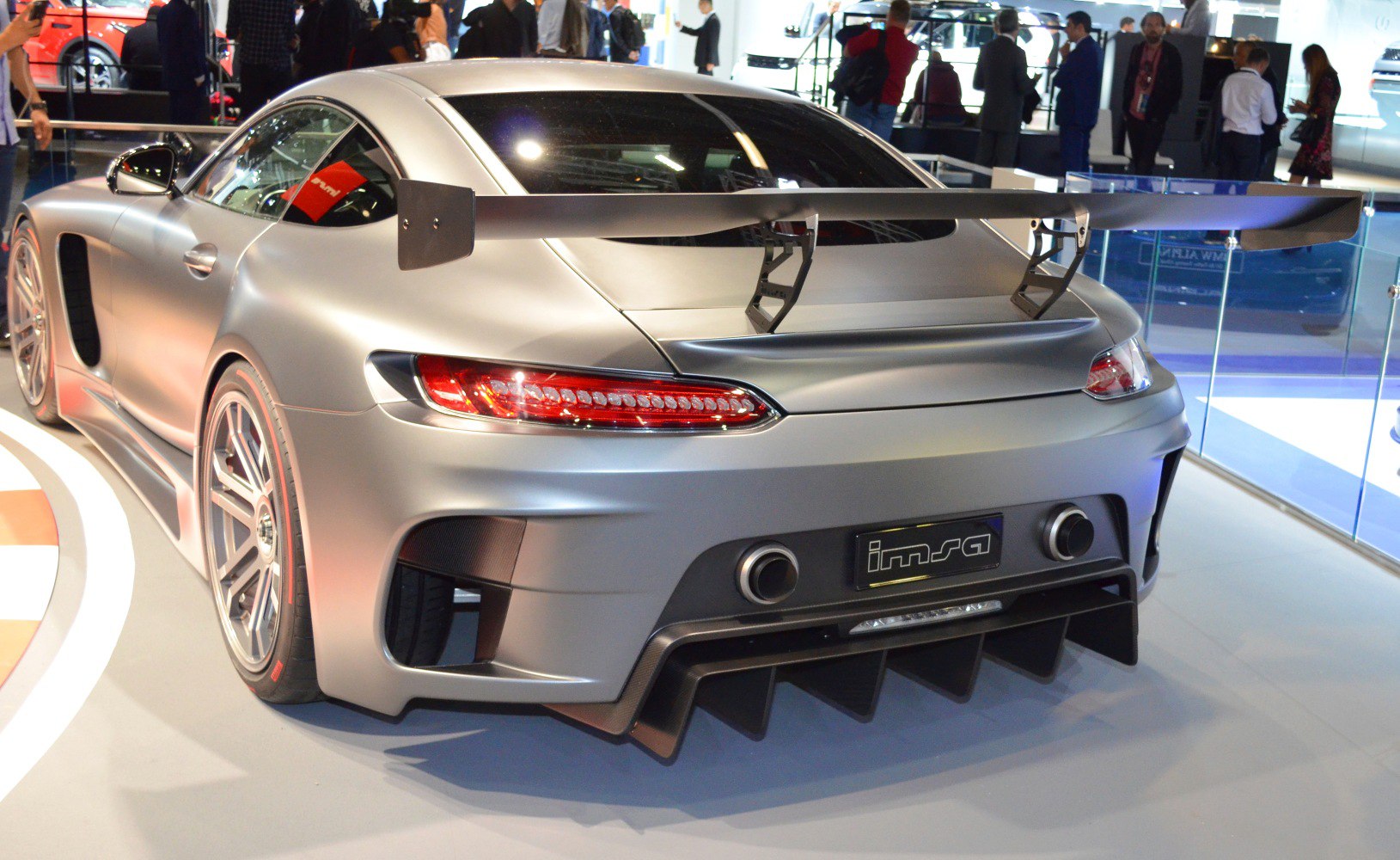 Large rear wing and diffuser on a sportscar rear with dual exhaust outlets
