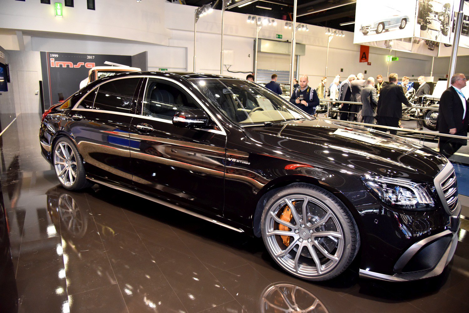 Black luxury sedan with V8 Biturbo and alloy wheels side profile