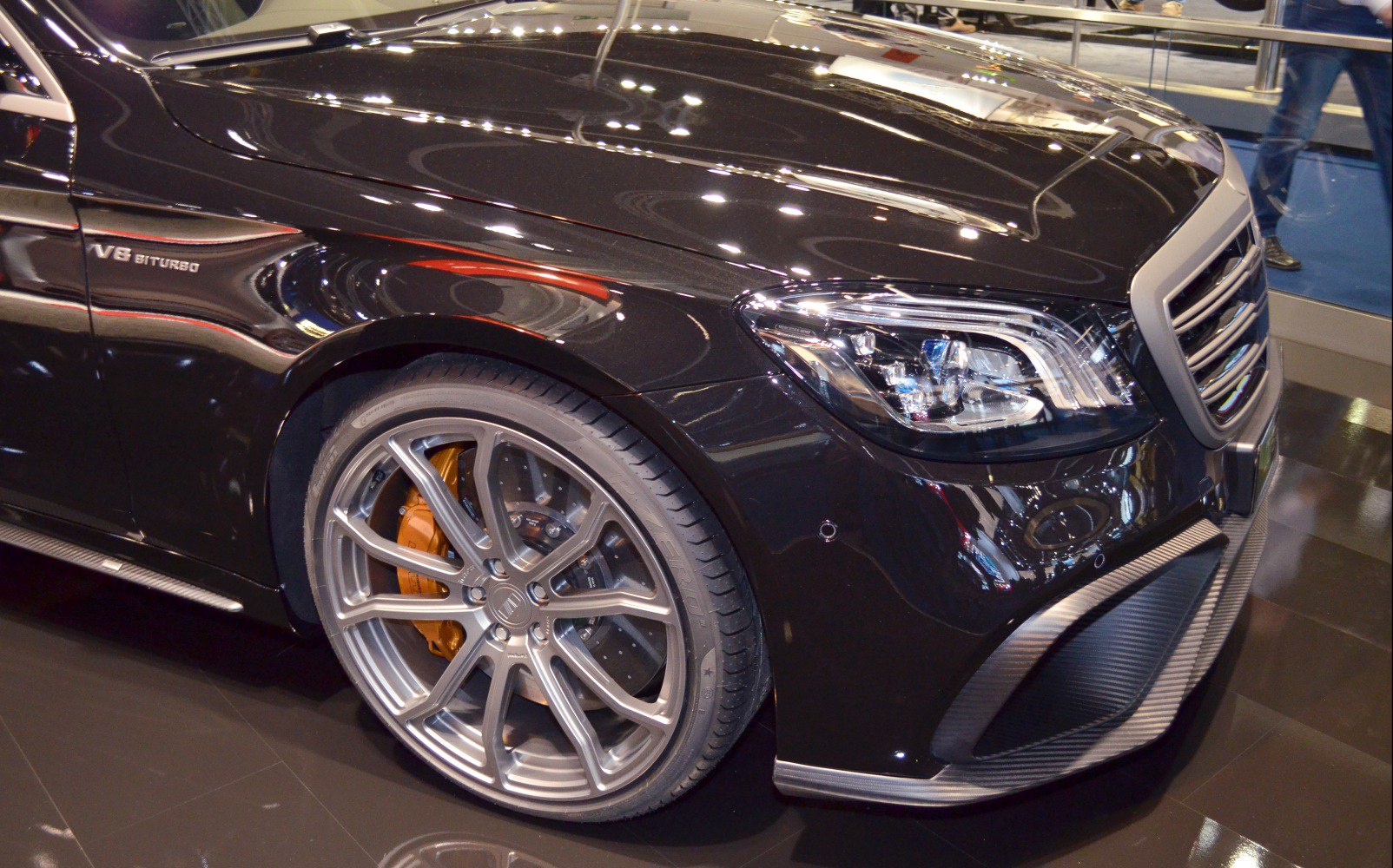 Front fender with V8 biturbo badge, alloy wheel, and headlight
