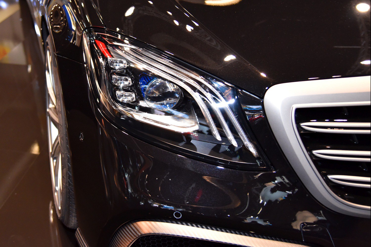 Close-up of modern headlight with detailed grille elements