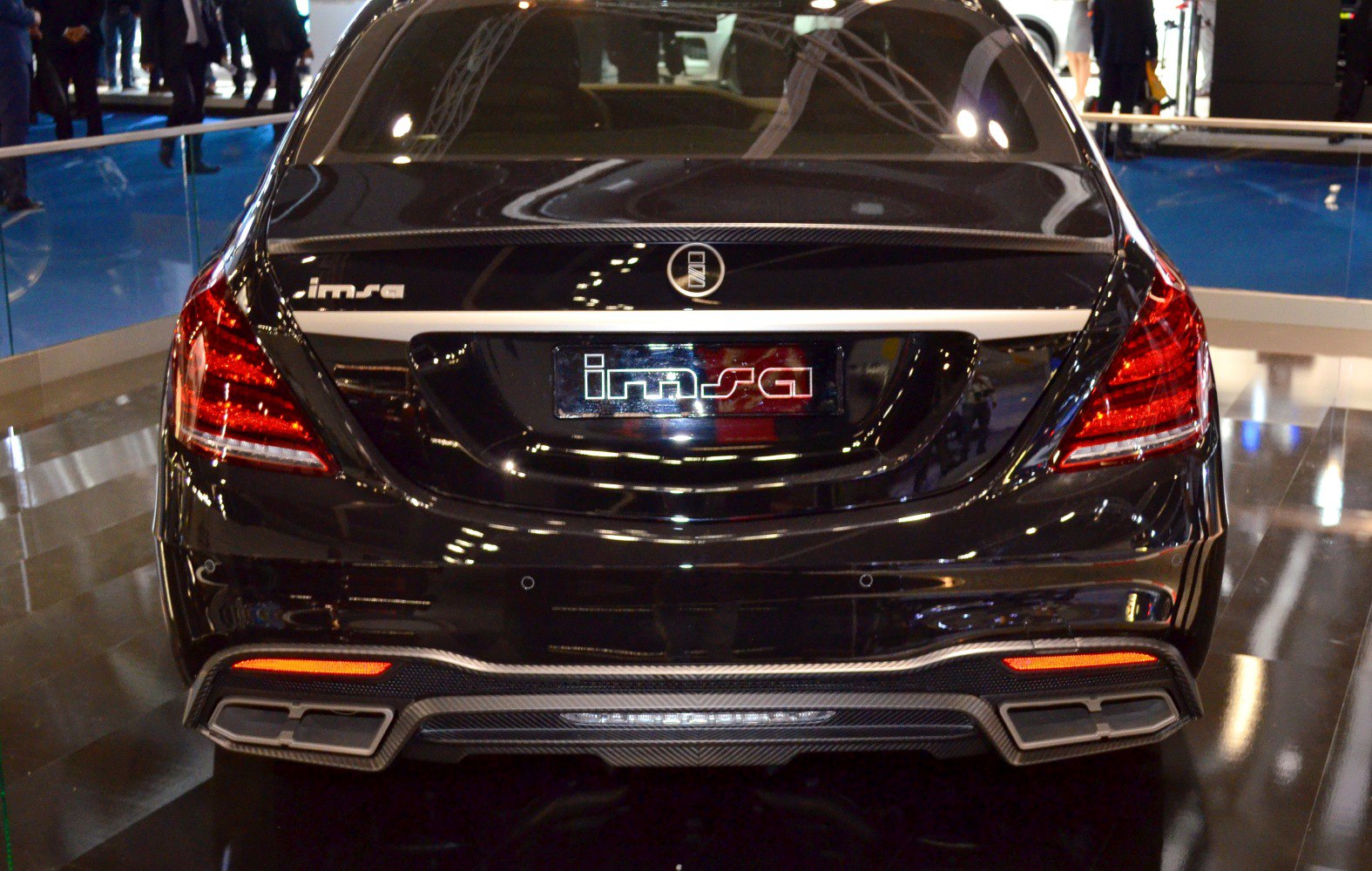 Rear view with distinctive taillights and dual exhaust design