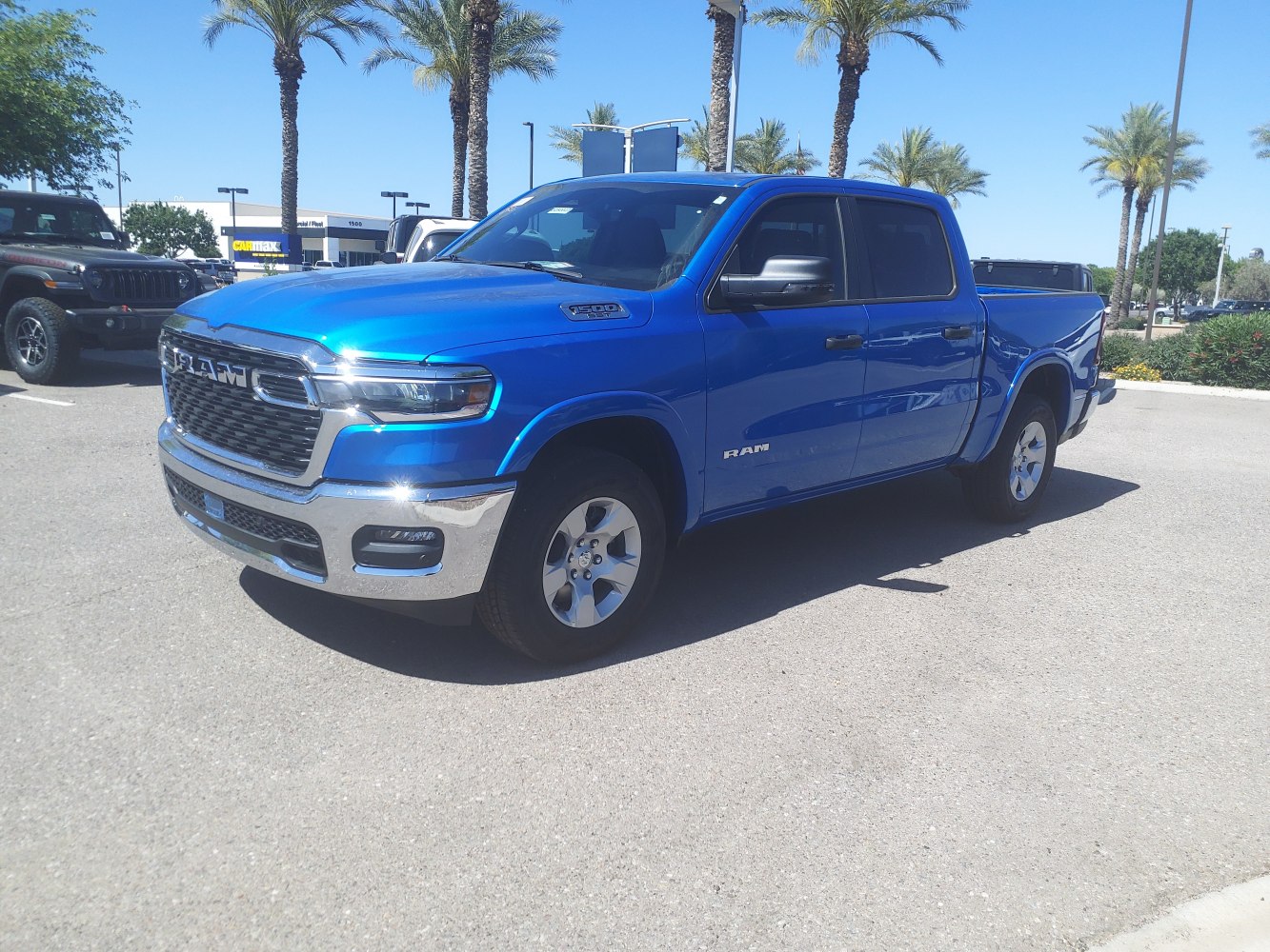 Bold front grille, chrome bumper, and crew cab pickup in vivid blue
