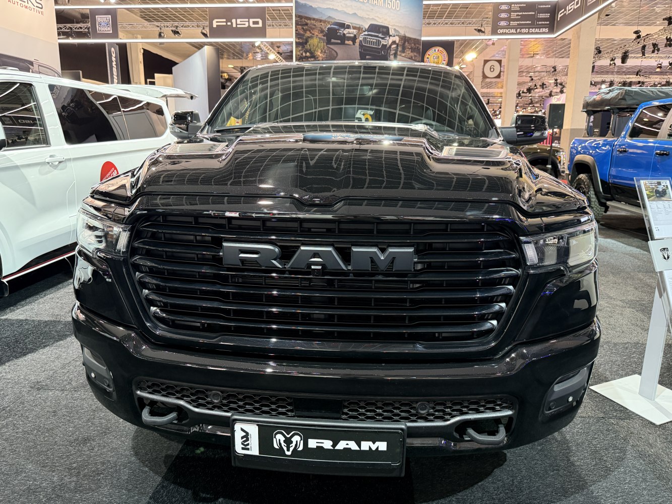 Front grille and headlights of a black pickup truck