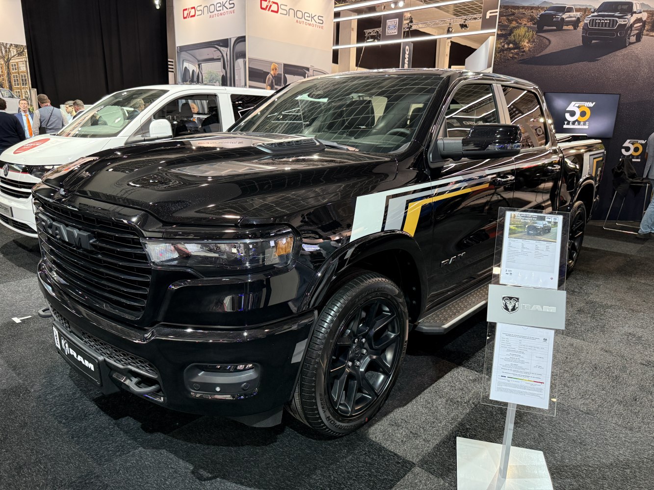 Black pickup truck with crew cab and prominent grille