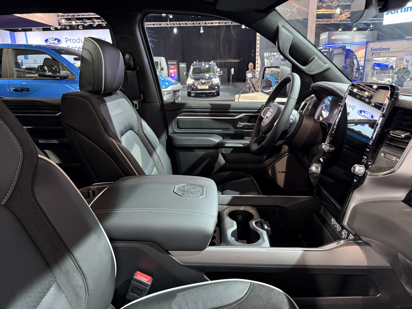 Premium truck seats and large touchscreen dashboard display.