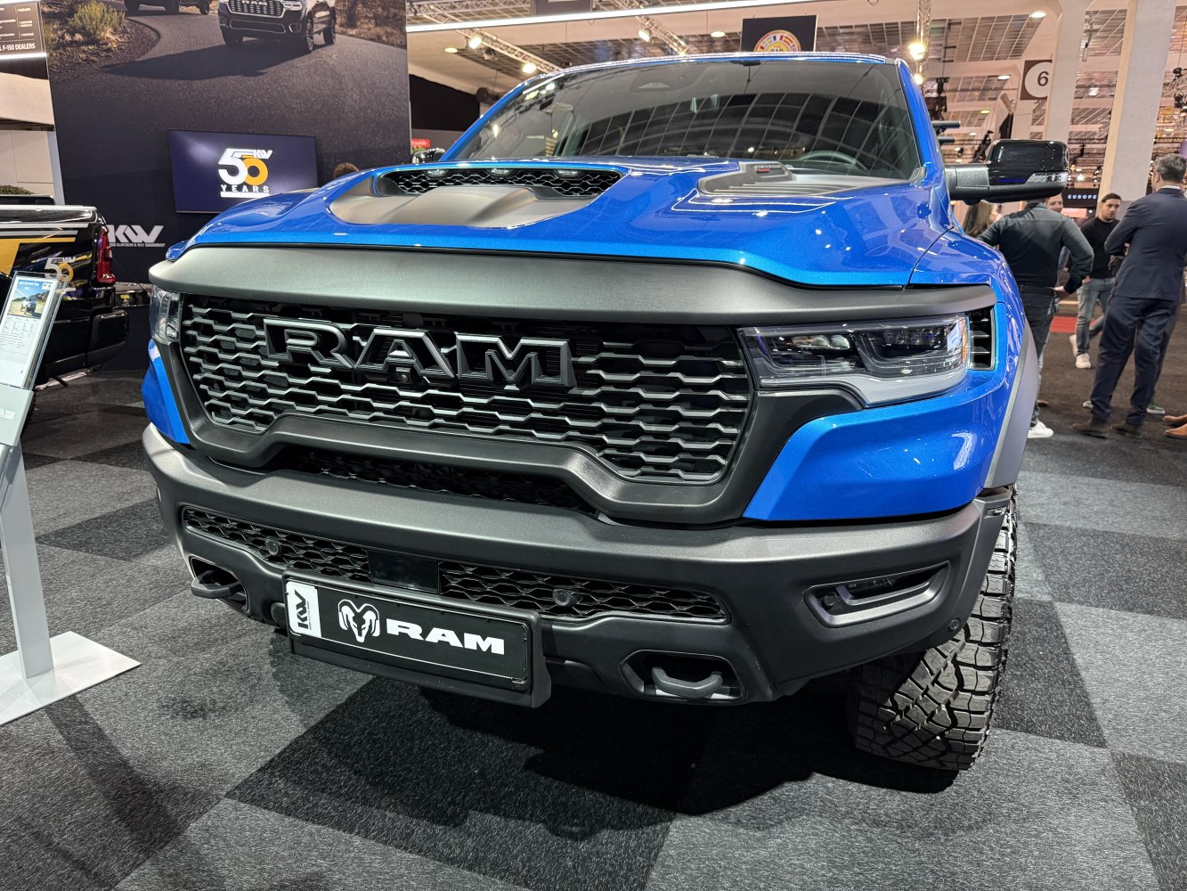 Bold front grille and hood scoop with off-road tires