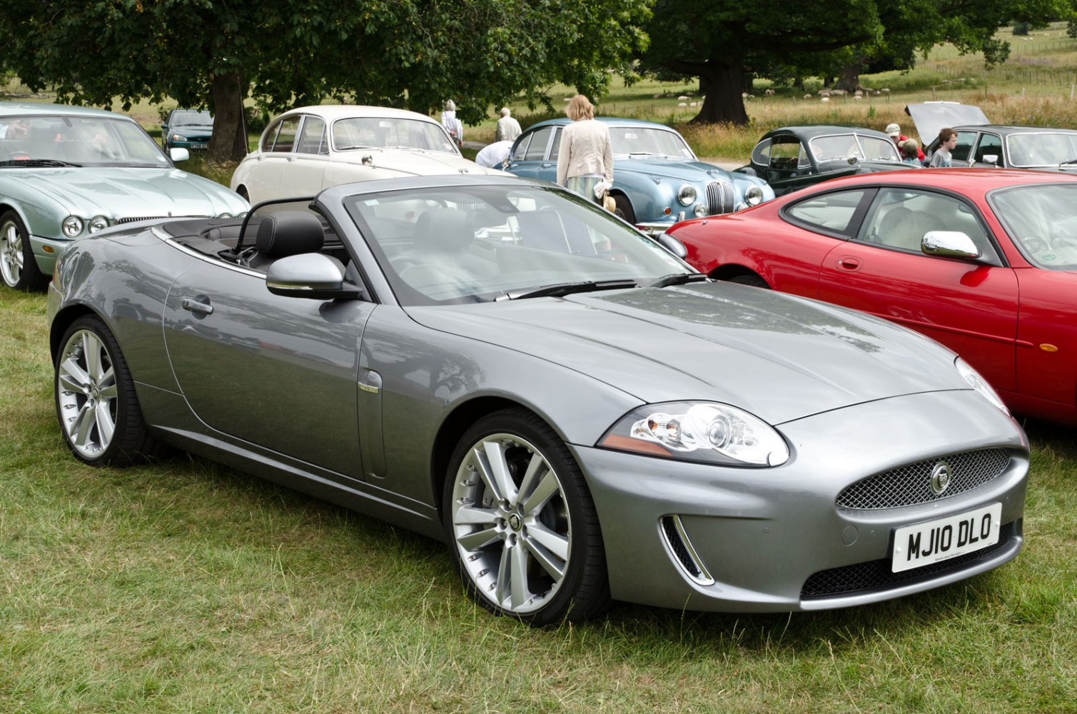 Convertible sports car with distinct grille and alloy wheels