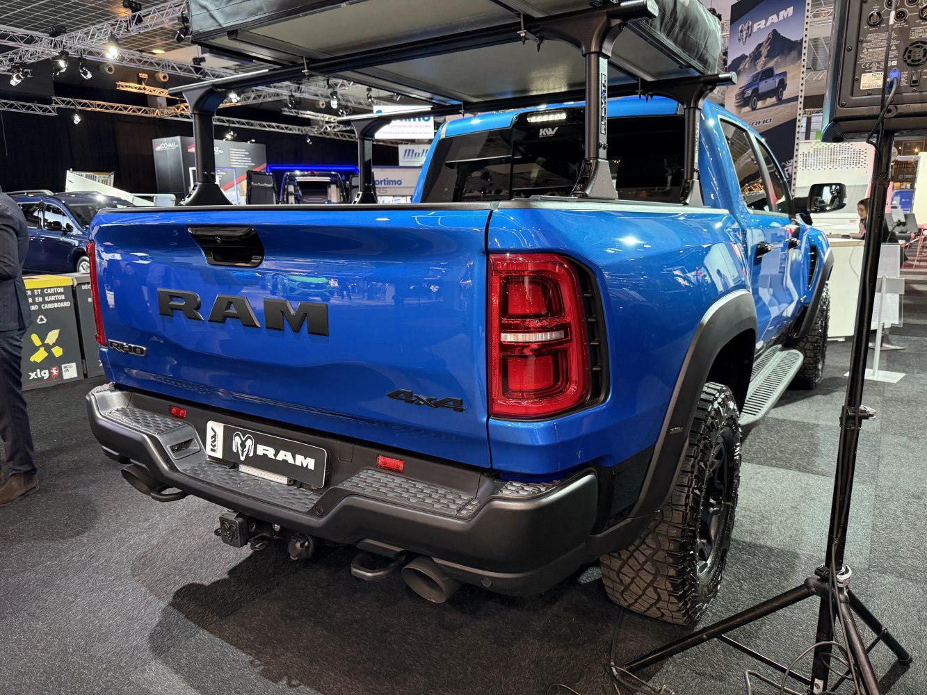 Rear tailgate and rugged off-road tires of a pickup truck