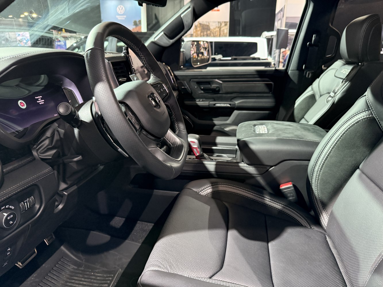Leather seats and steering wheel in modern truck interior
