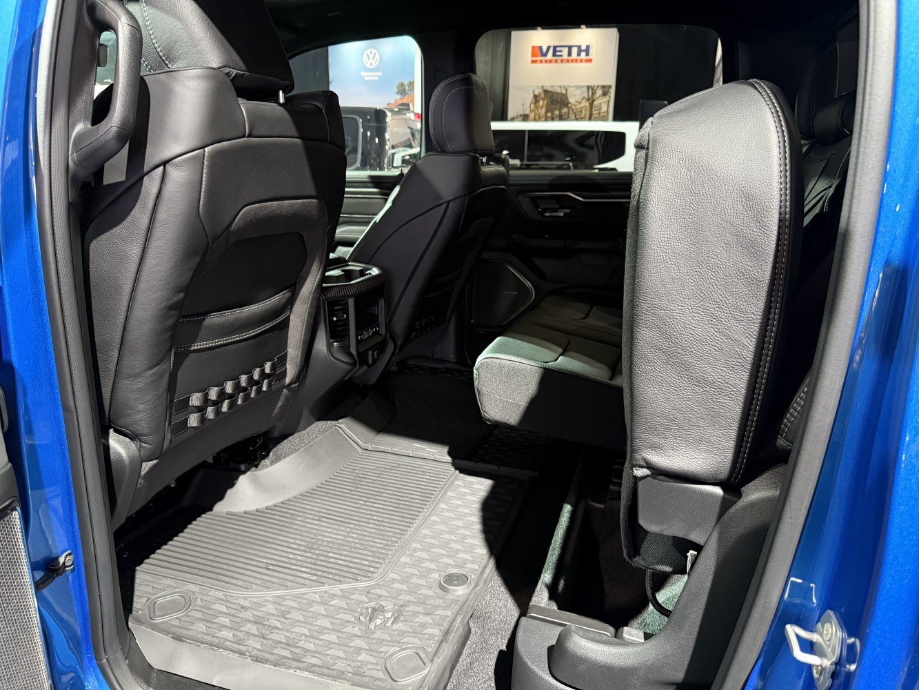 Rear leather seats and detailed floor mats with spacious legroom