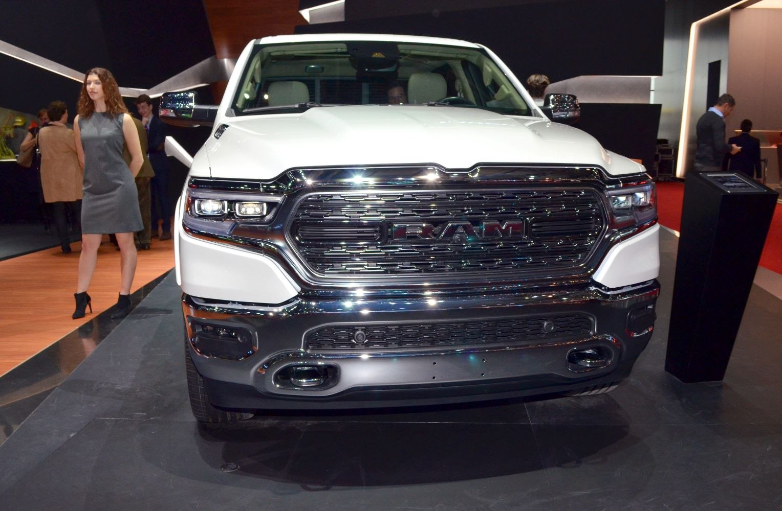 Close-up of front grille and LED headlights on a pickup truck.