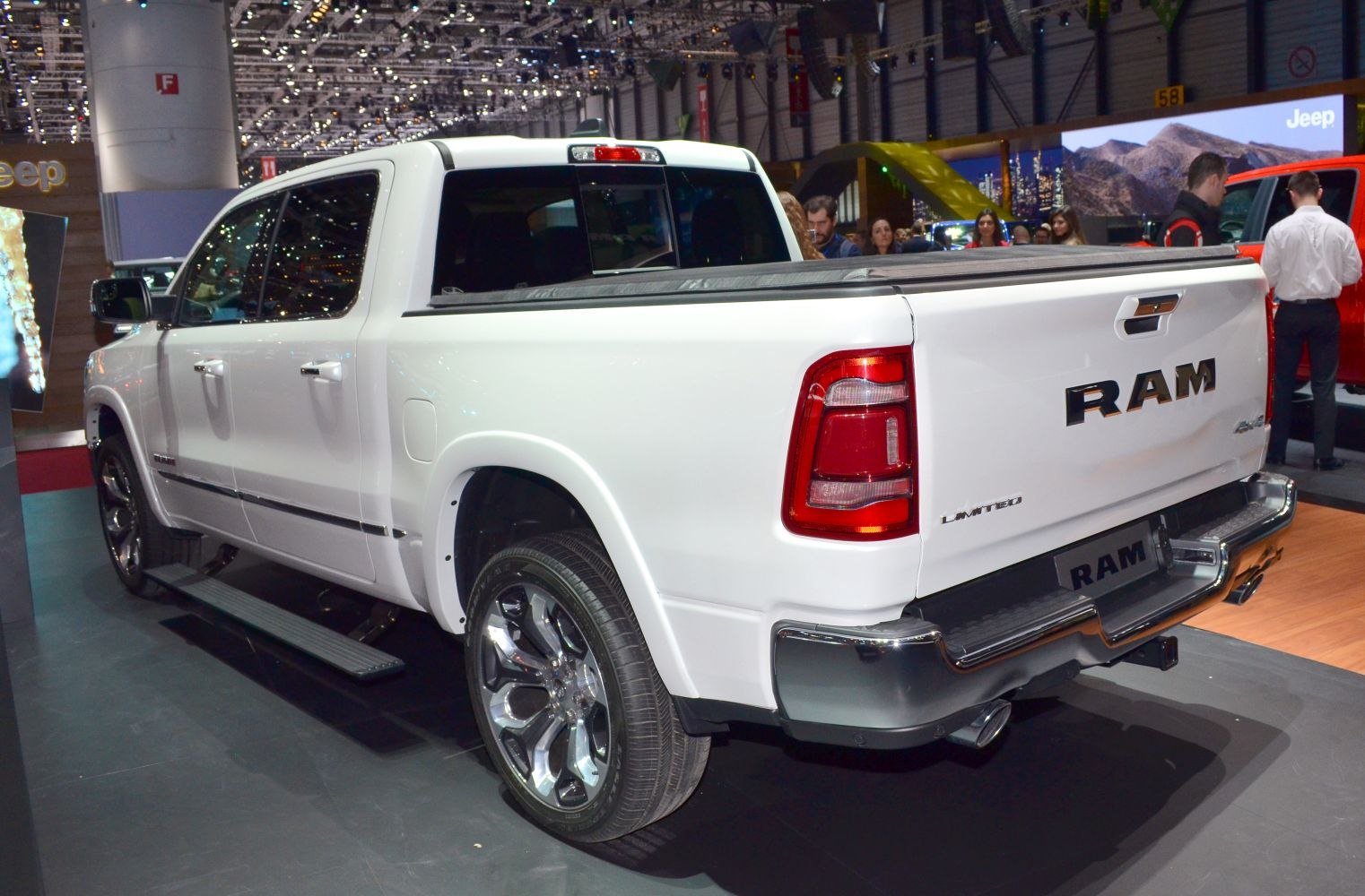 White pickup truck rear side with bed cover and chrome bumper