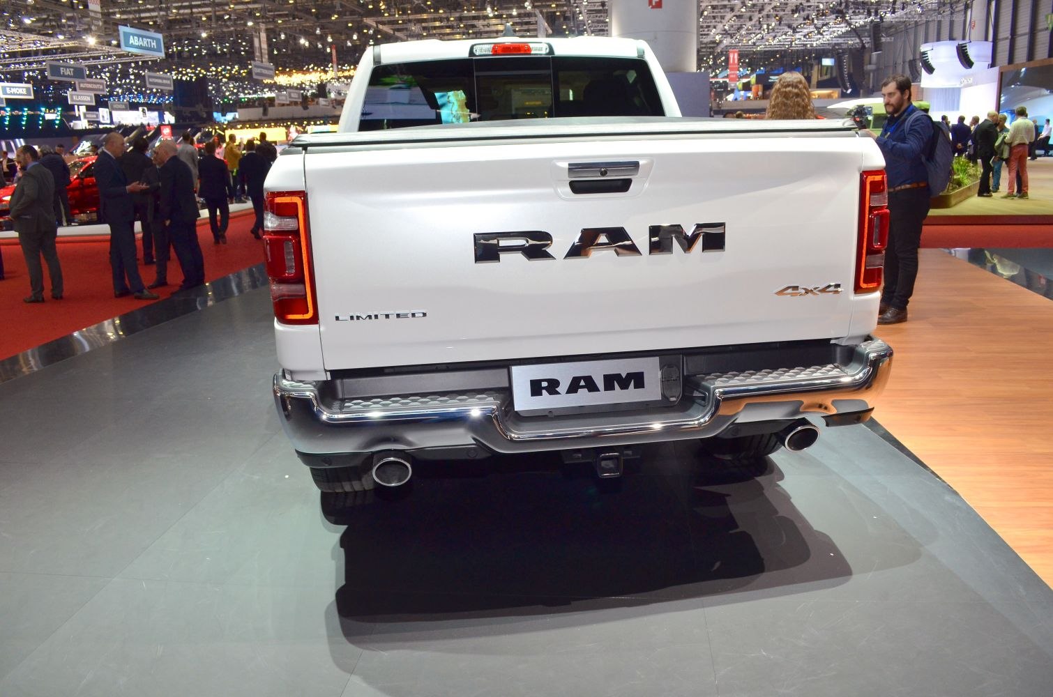 Pickup rear view with RAM logo, Limited and 4x4 badges, dual exhausts