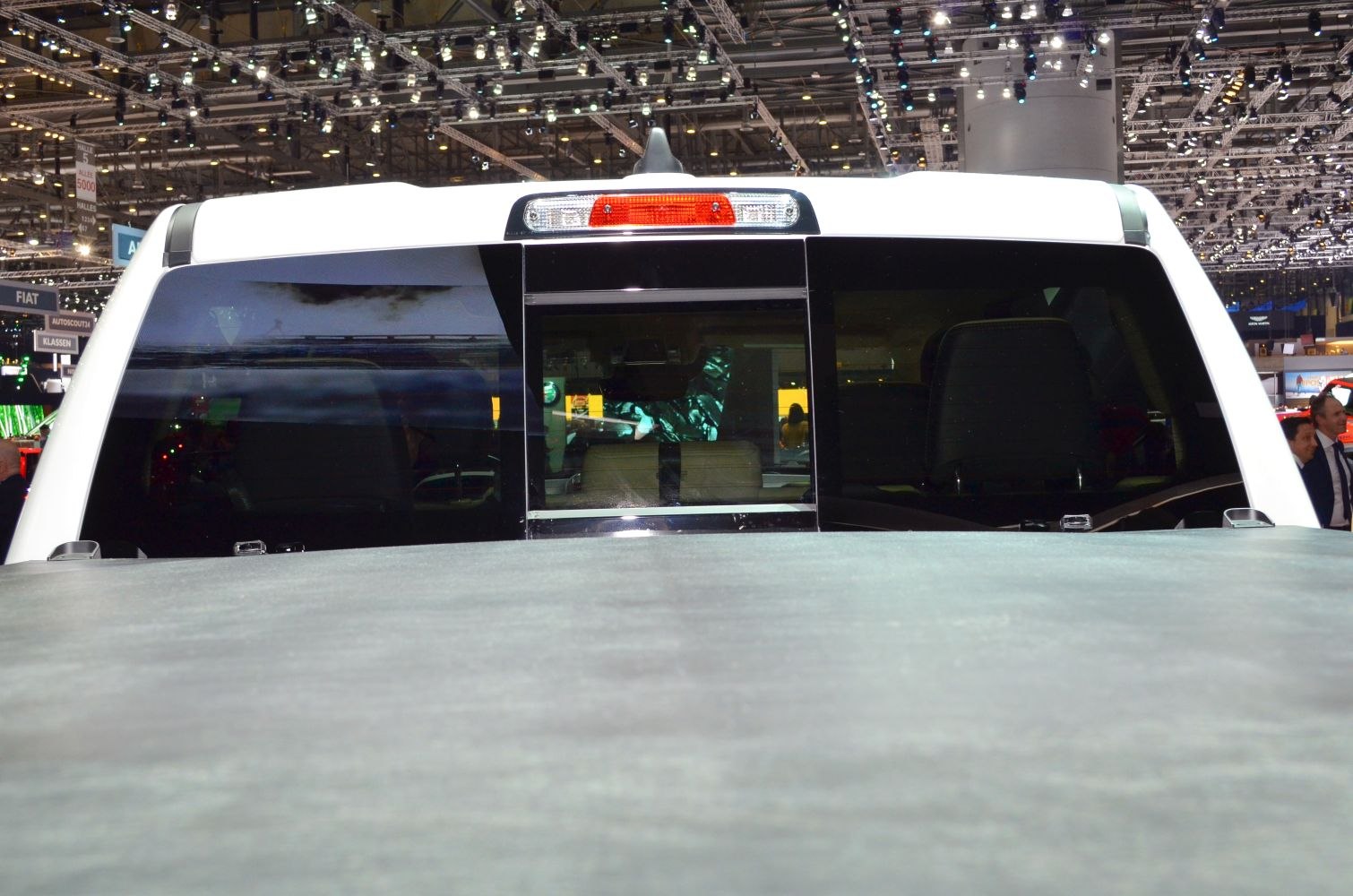 Rear window with sliding middle panel and covered cargo bed.