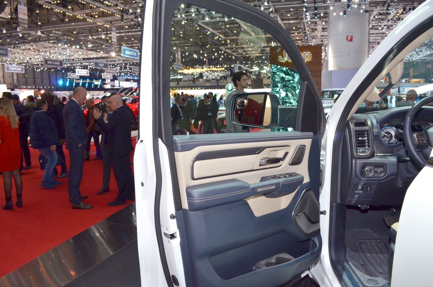Driver door interior panel with controls and speaker