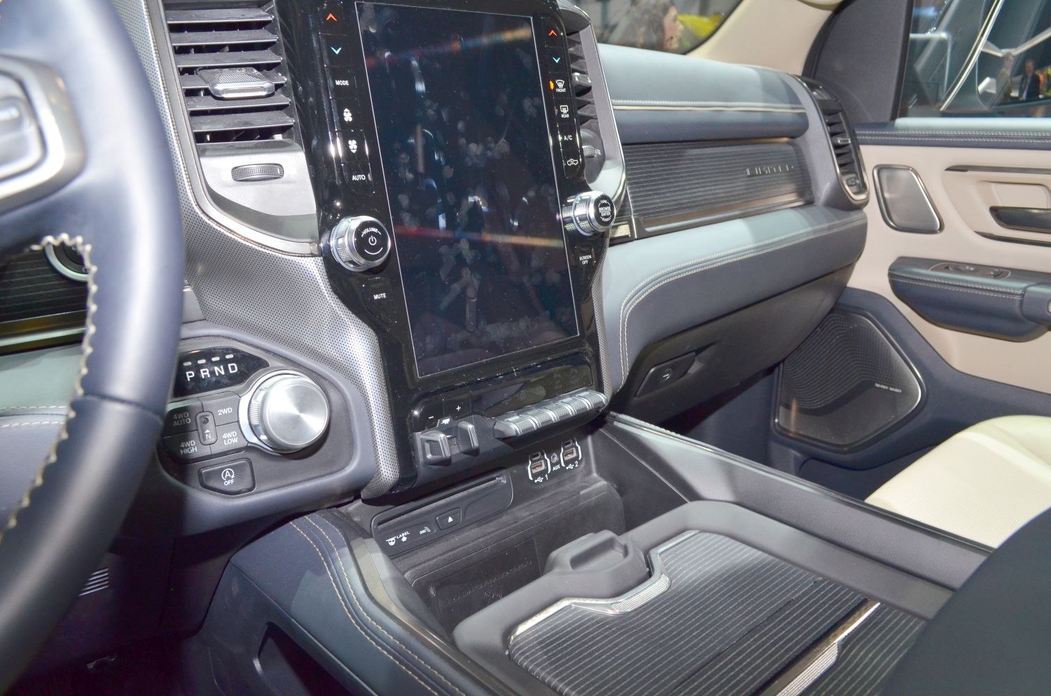 Large touchscreen, rotary gear selector, modern interior controls