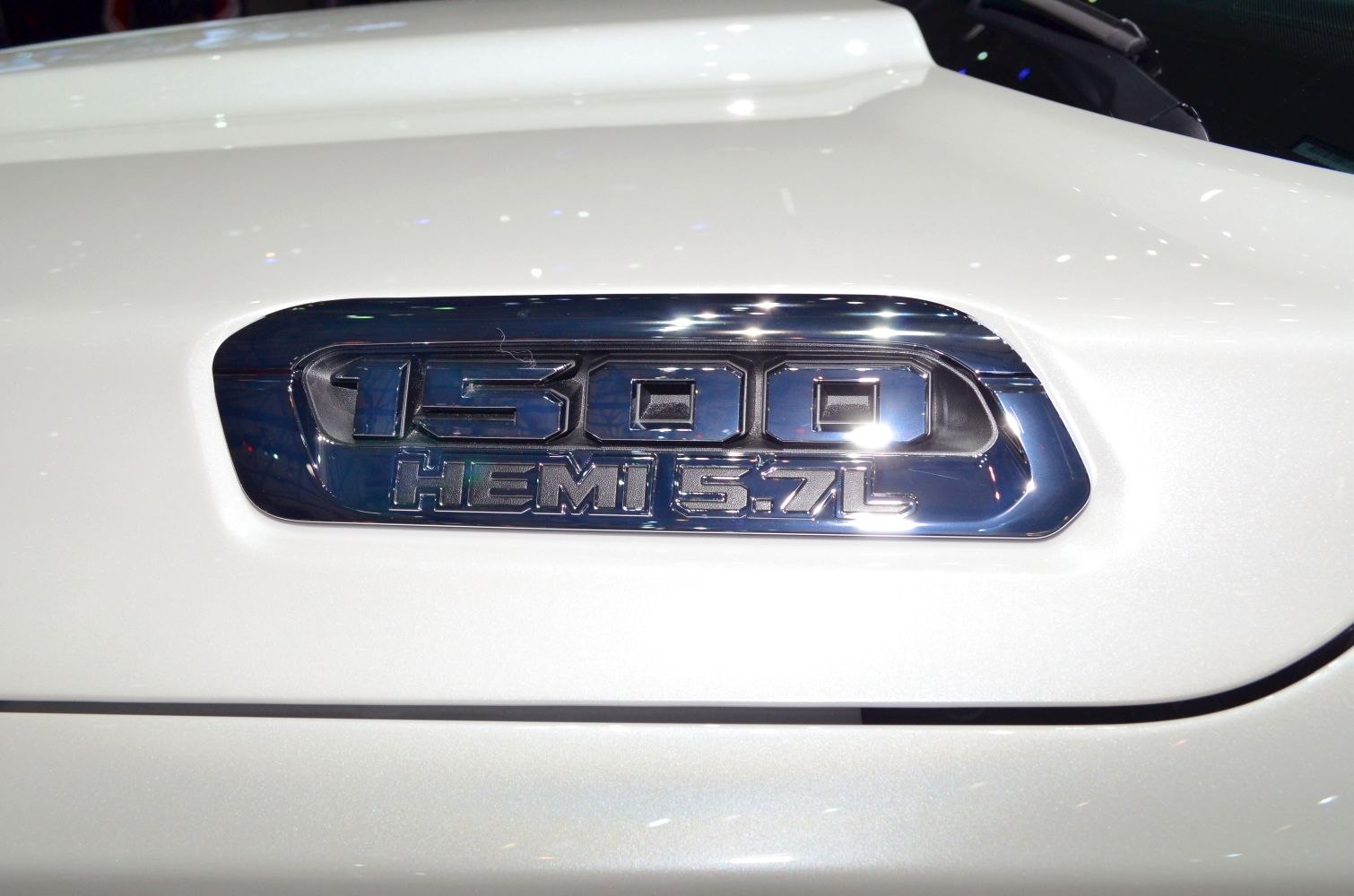 1500 HEMI 5.7L engine badge on white truck side