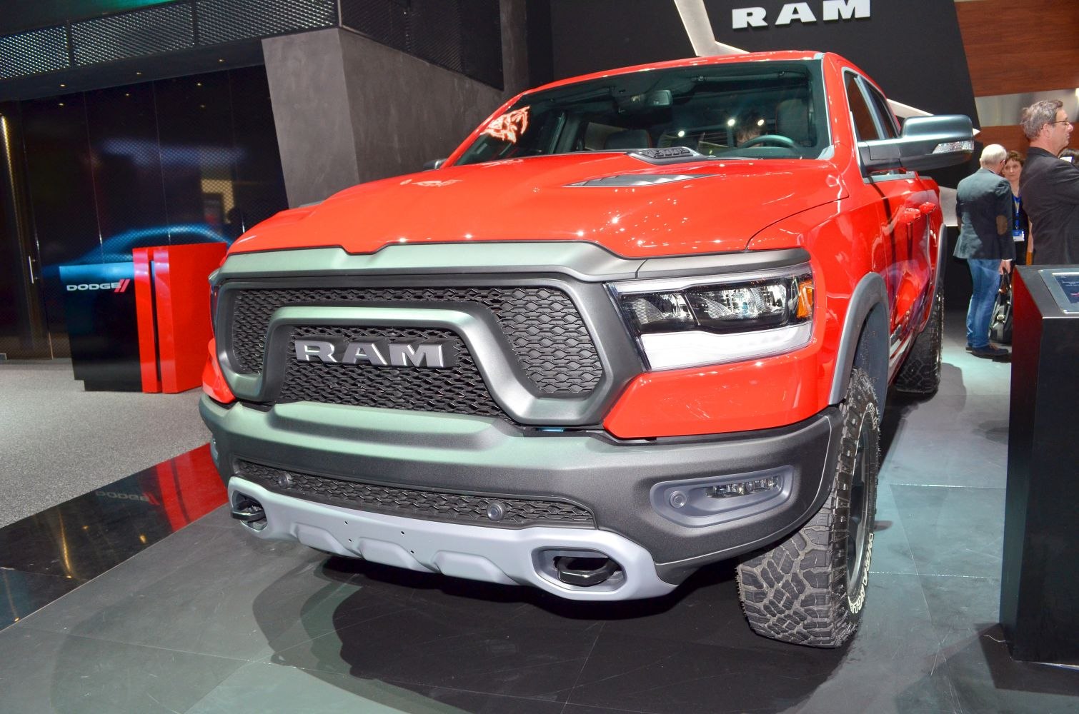 Aggressive front grille, LED headlights, hood scoop, and off-road tires