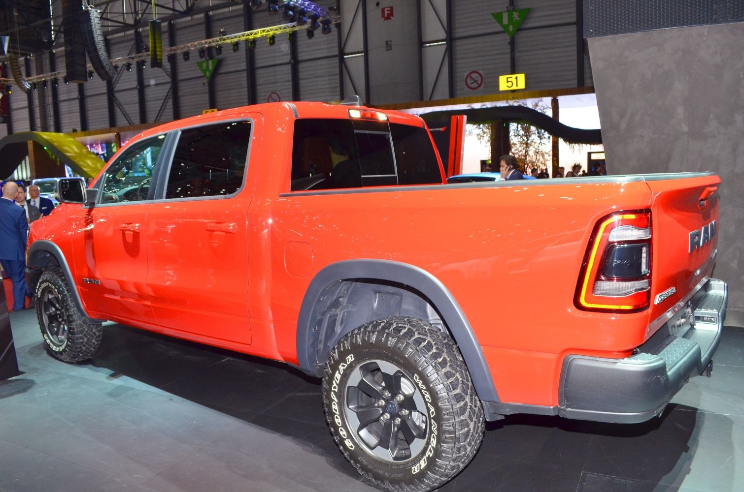 Rear side view of pickup with off-road tires and modern tail lights