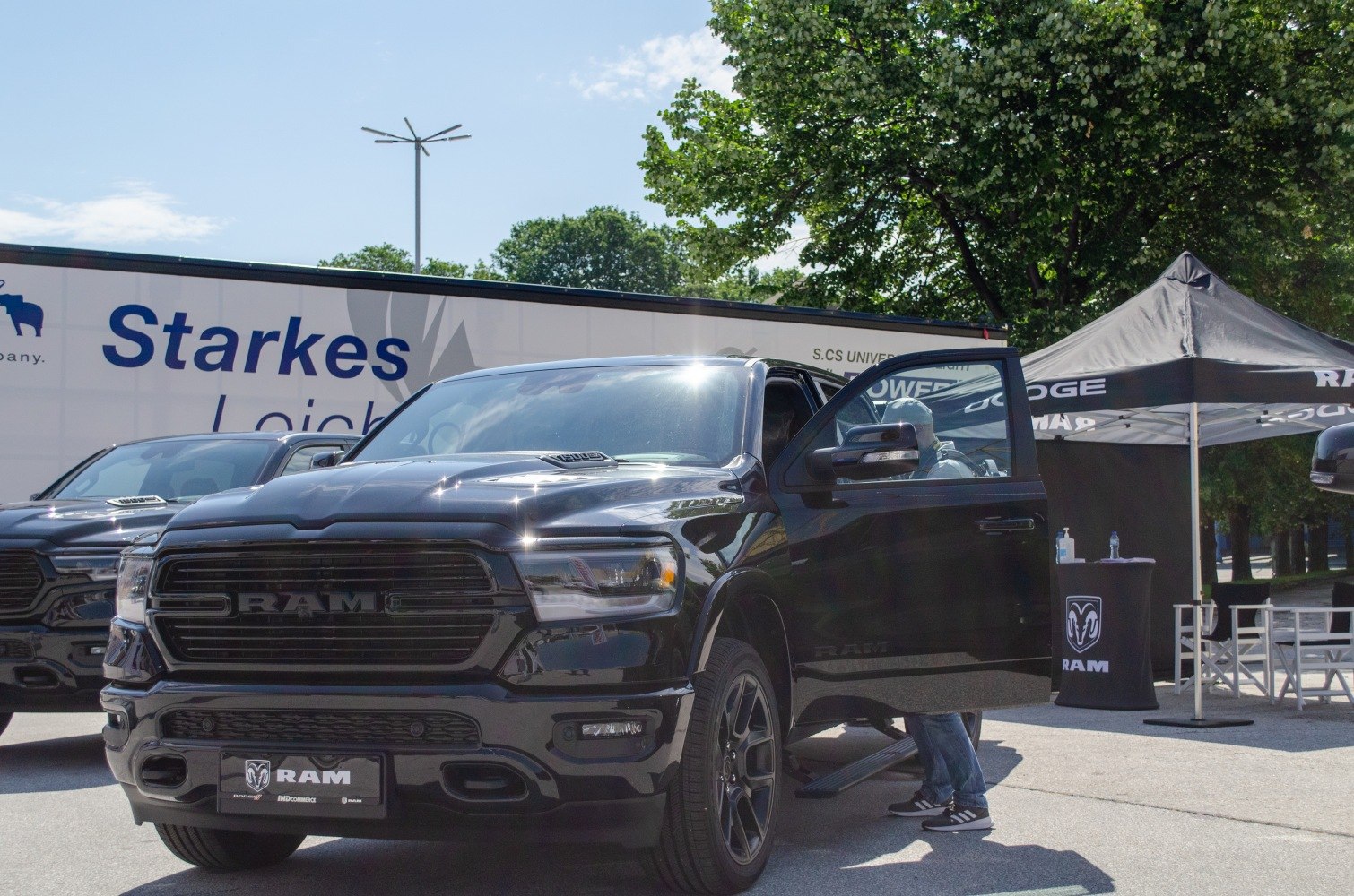 Black pickup front grille with open driver door