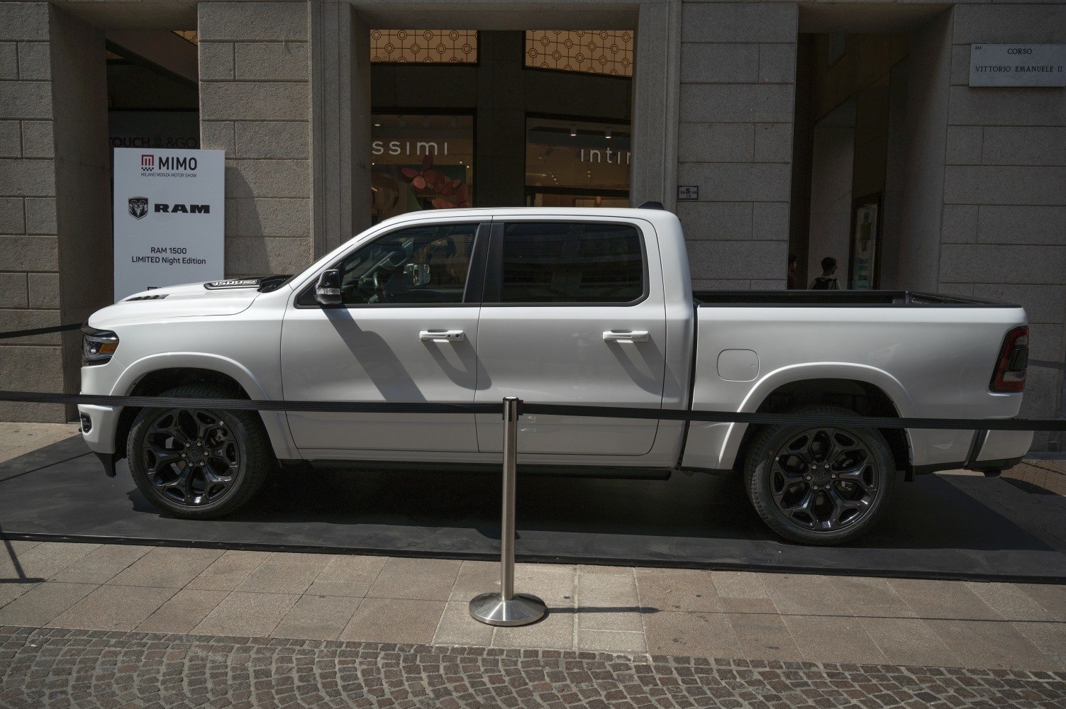 White pickup truck side profile with black alloy wheels