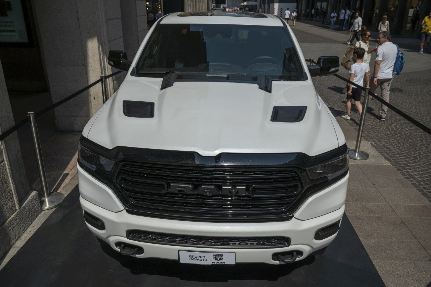 Front grille and hood vents of a pickup truck with aggressive styling