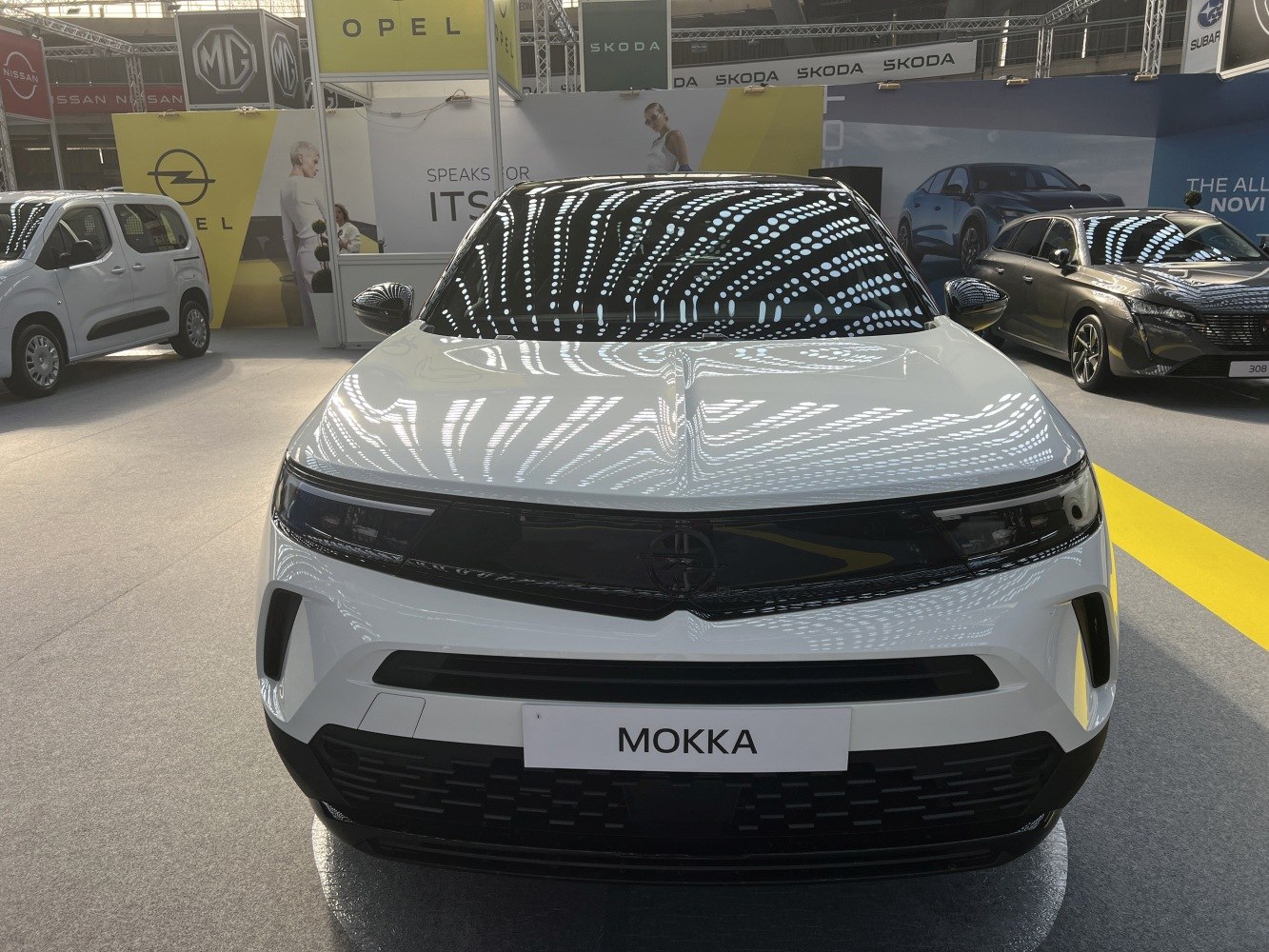 Front view showing sleek LED headlights and modern grille design