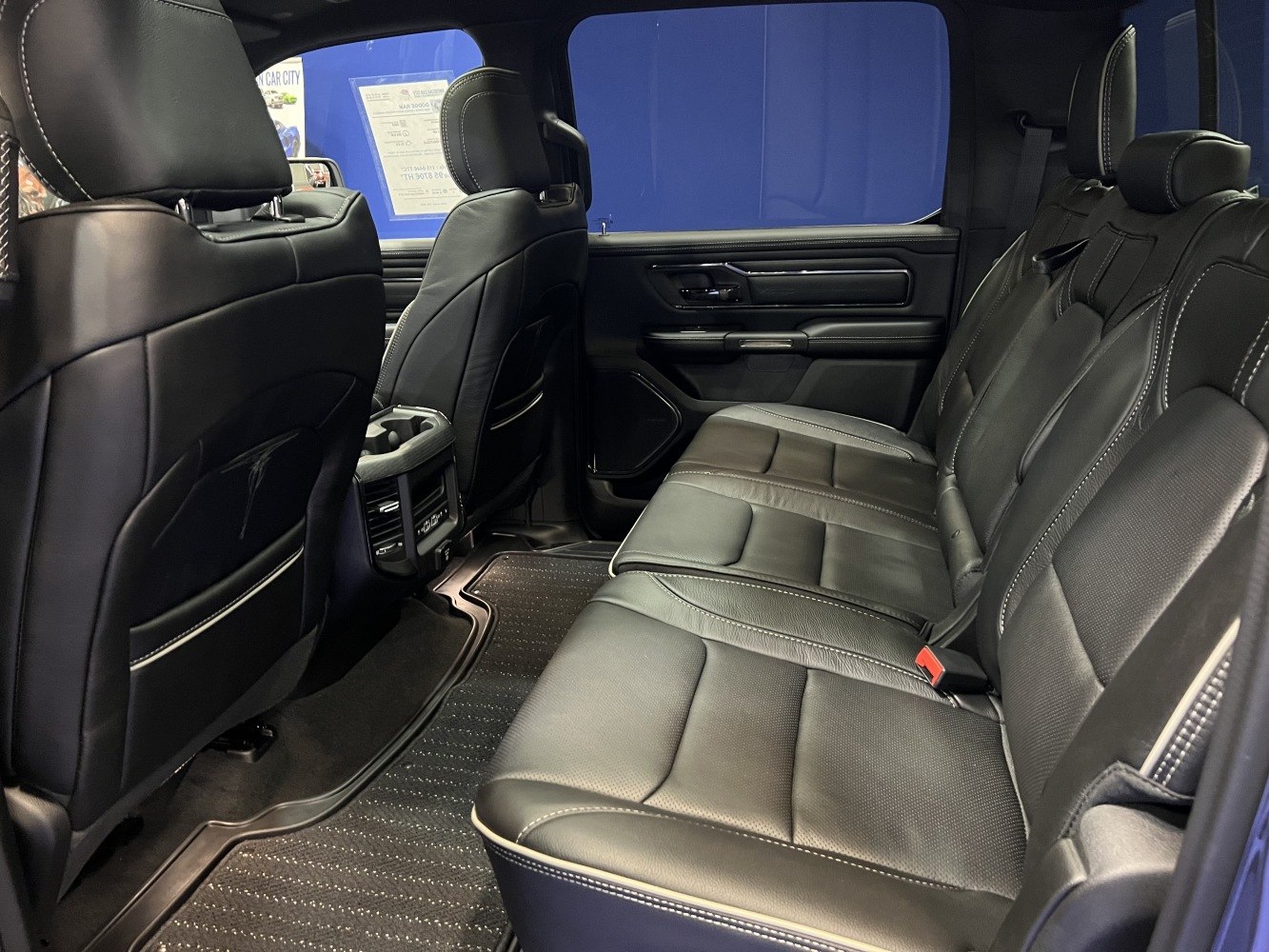 Spacious rear leather seating with detailed stitching and modern door panel