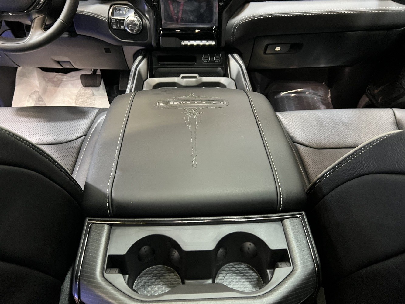 Leather center console with embroidered 'LIMITED' badge and dual cup holders