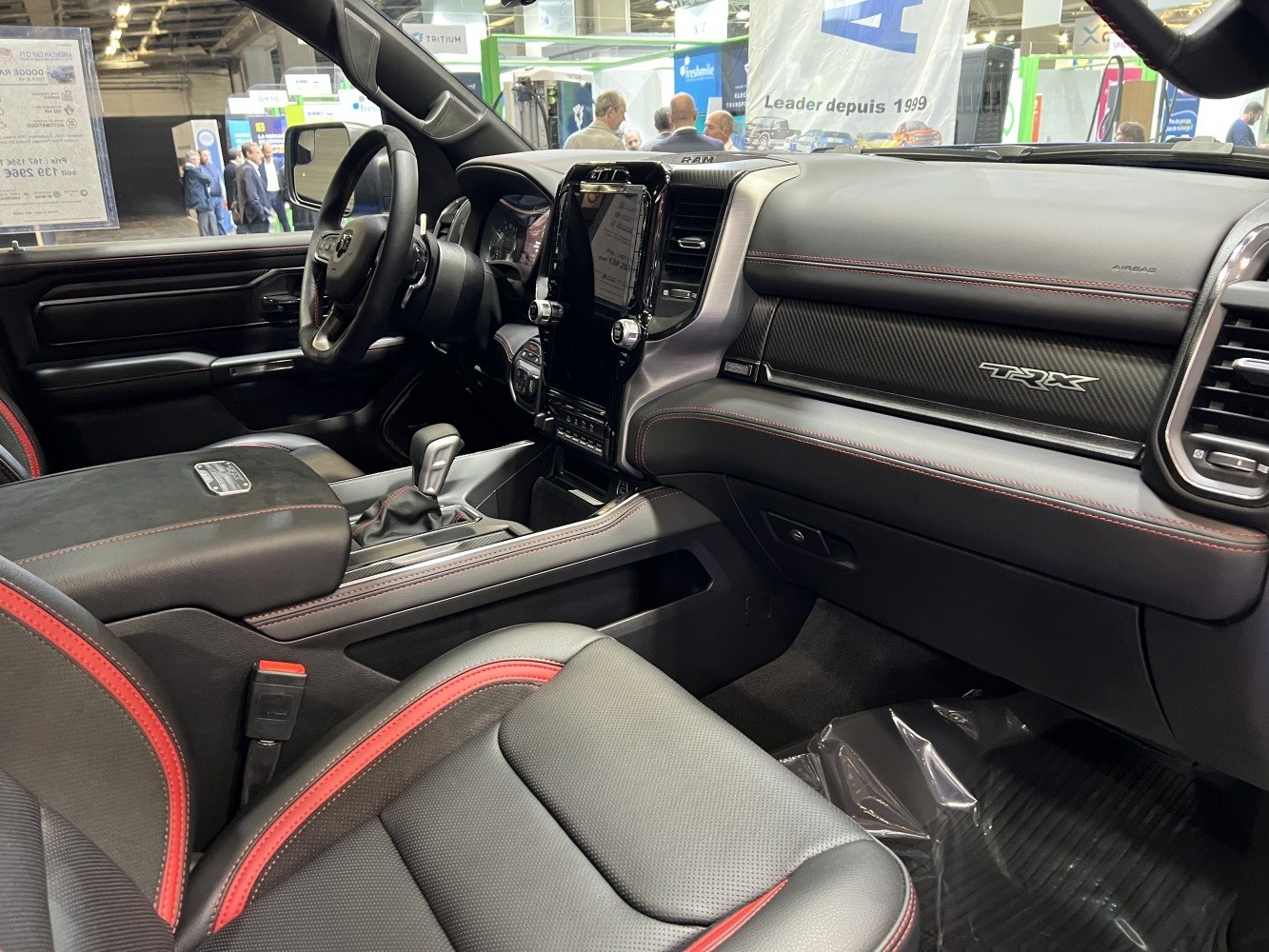 Modern pickup interior with TRX badge and red stitched leather seats