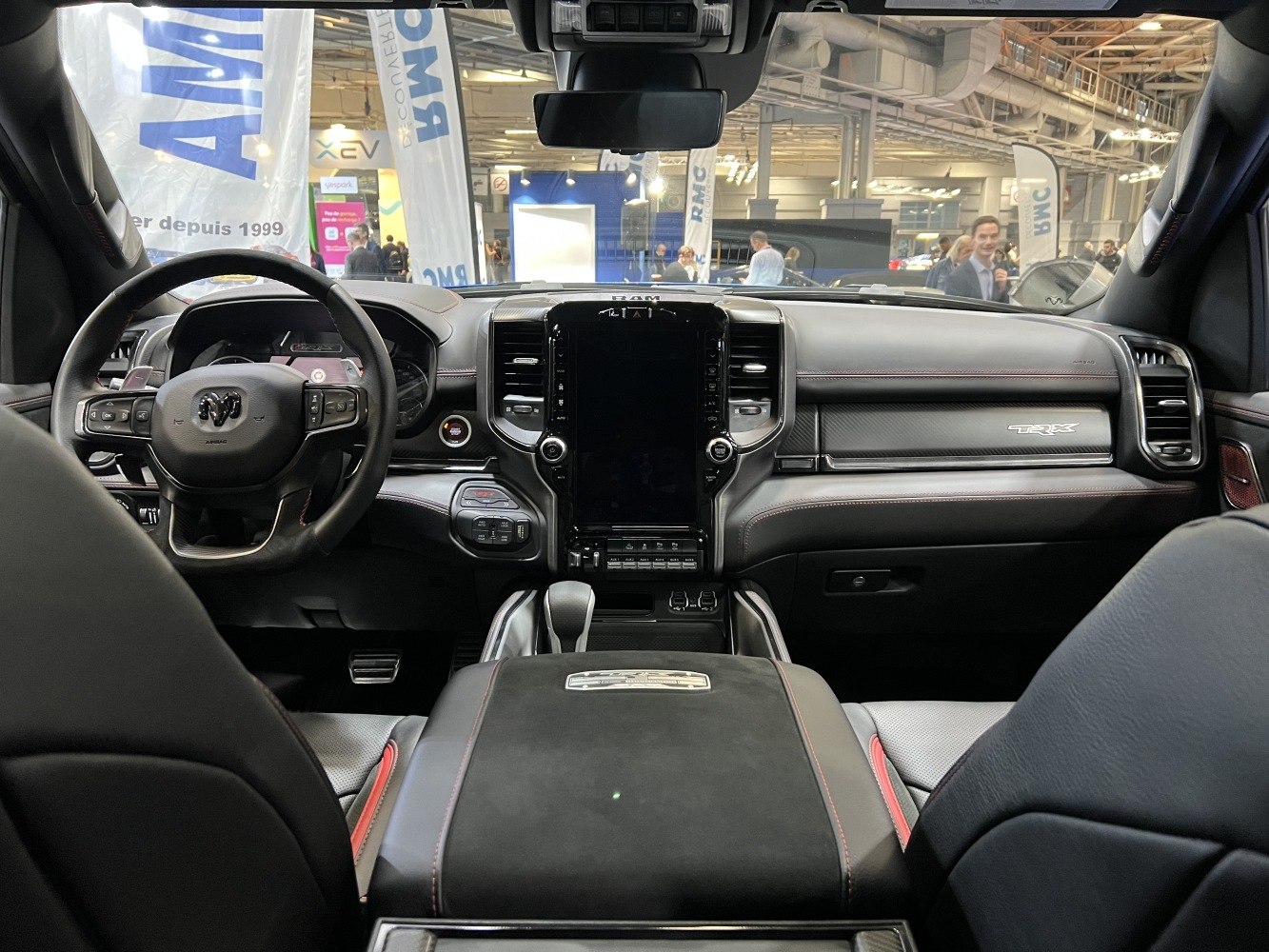 Dashboard and steering wheel of a luxury pickup truck with touchscreen and control buttons