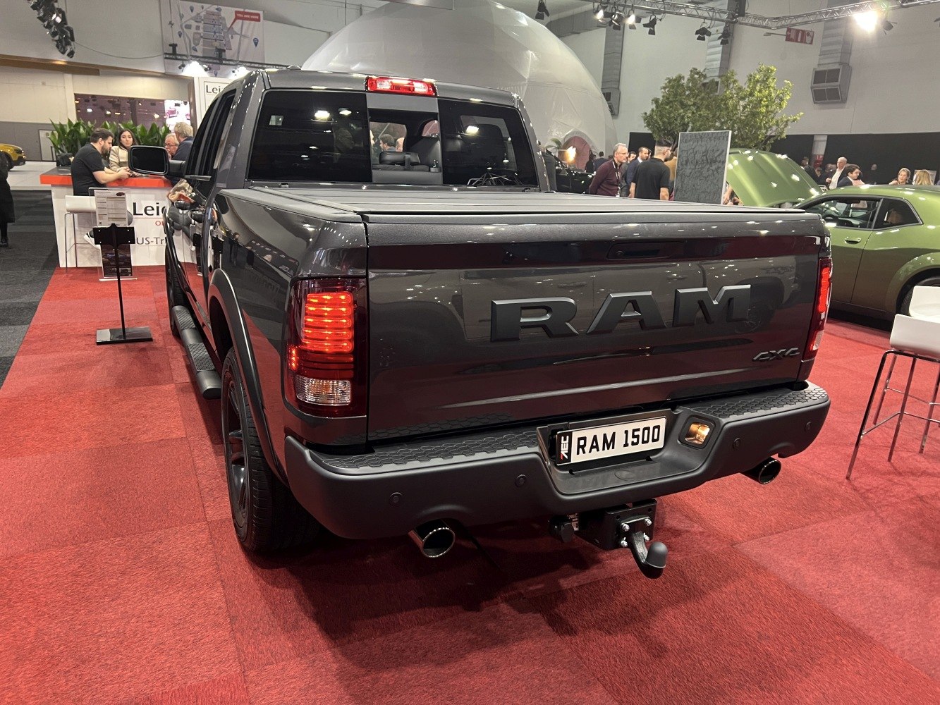 Rear view of pickup showing taillights, tow hitch, and bed cover