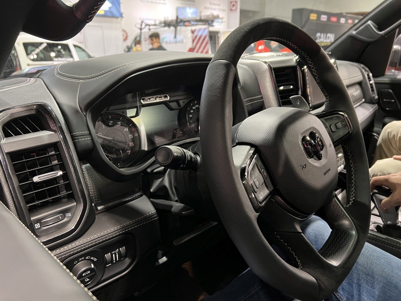 Steering wheel and dashboard with digital gauges and controls