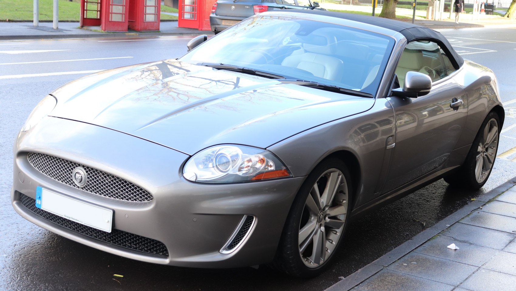 Front and side view of convertible with mesh grille and alloy wheels