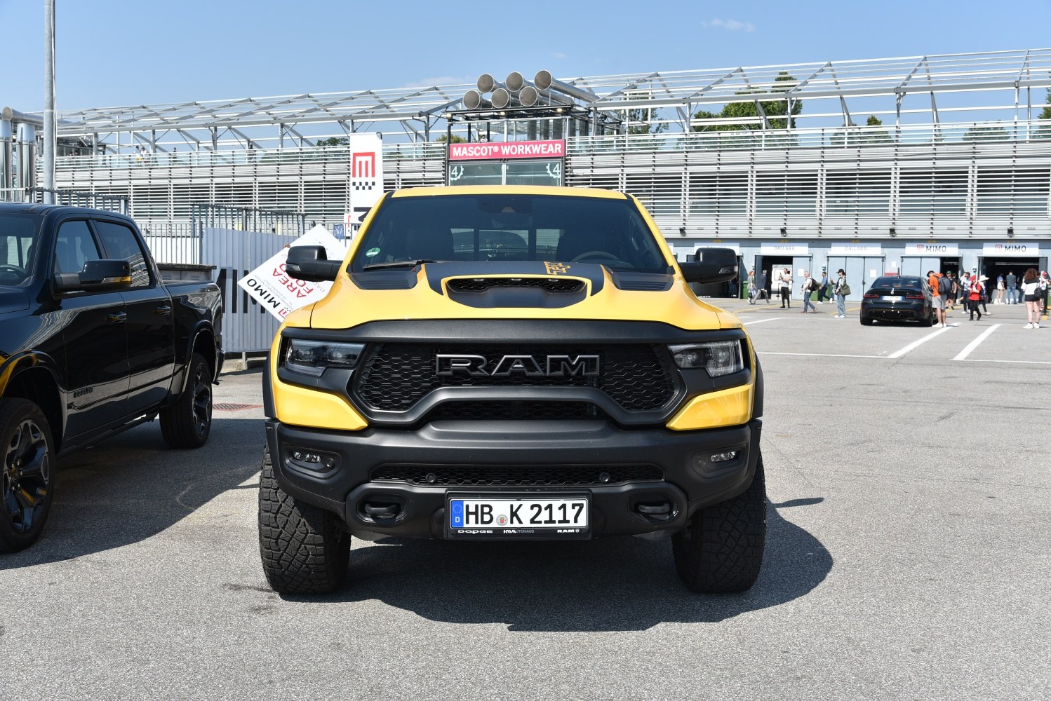 Aggressive front grille and hood scoop of a pickup truck
