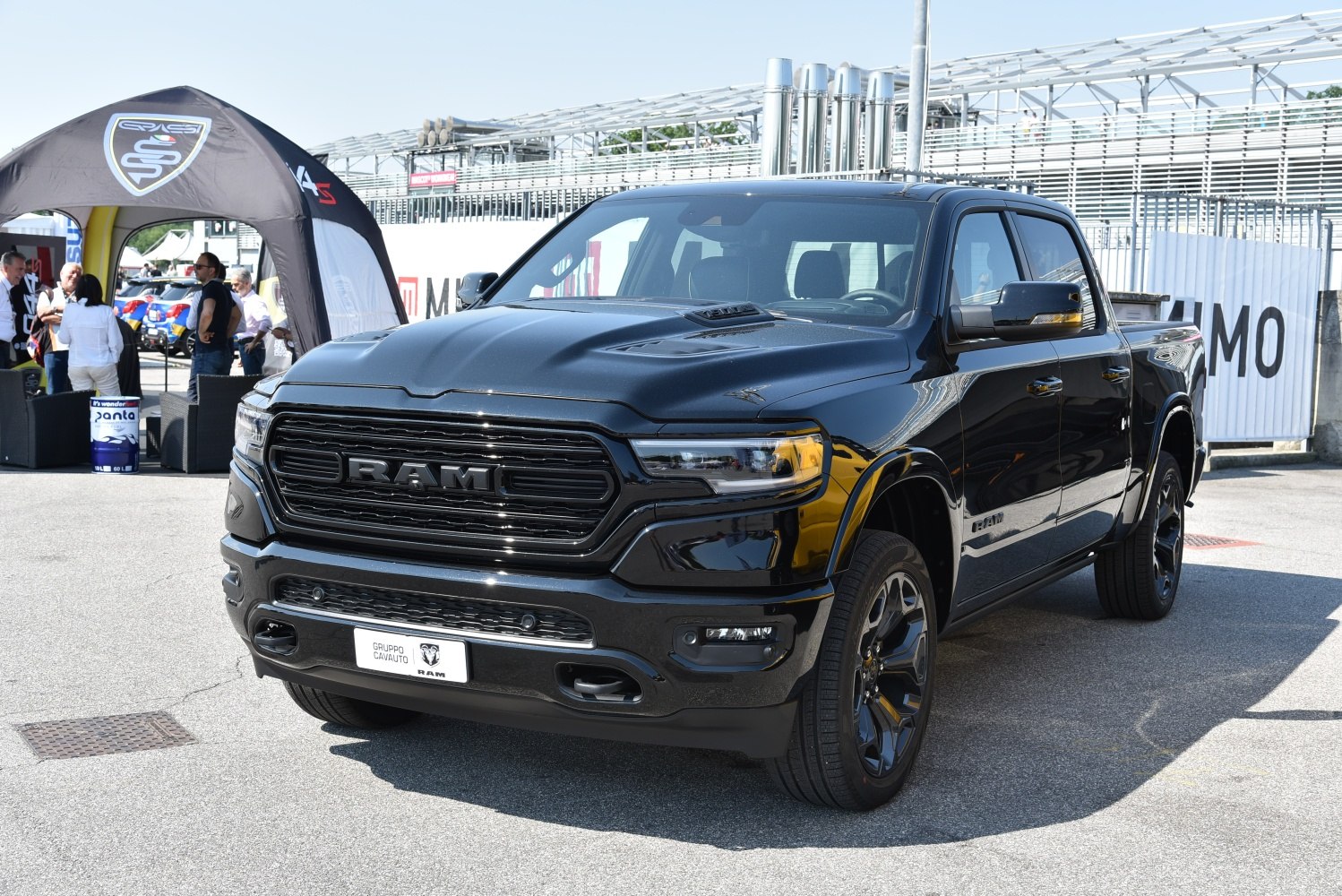 Black pickup truck front view with bold grille and headlights