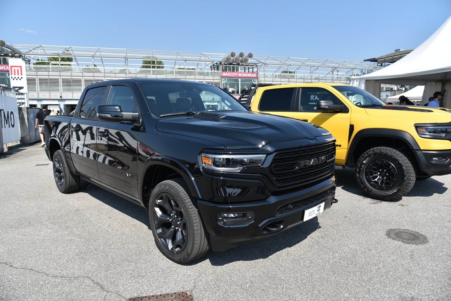 Black crew cab pickup with aggressive front grille and modern design