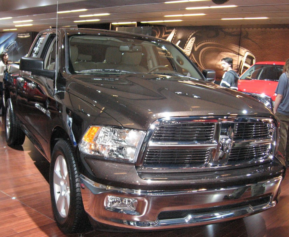 Front view of a pickup truck with a prominent chrome grille and headlights