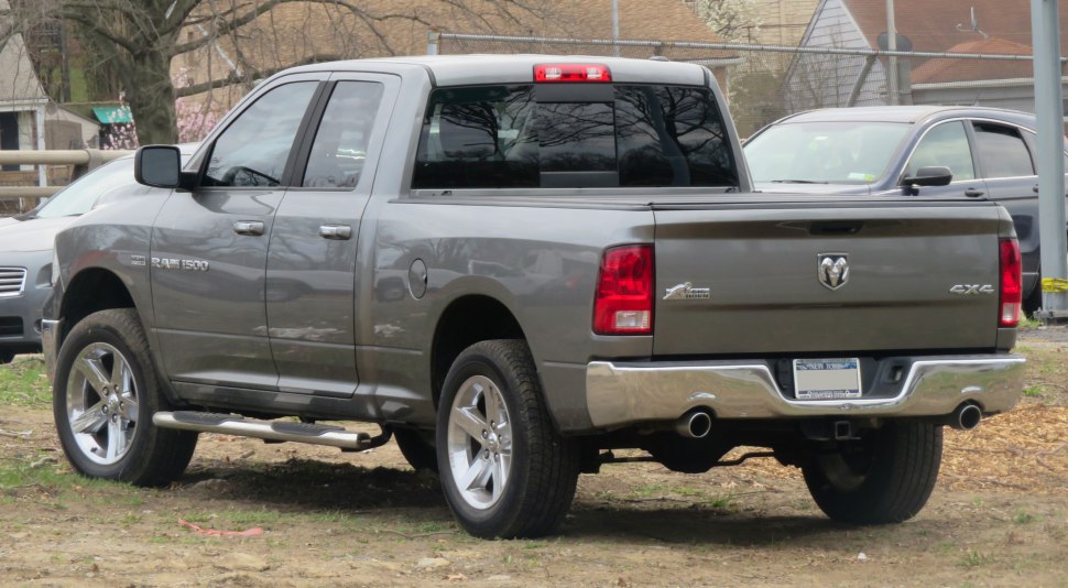 Rear side view with dual exhaust and chrome bumper