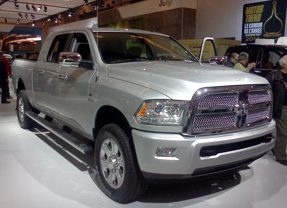Silver heavy-duty pickup with chrome grille and four-door crew cab