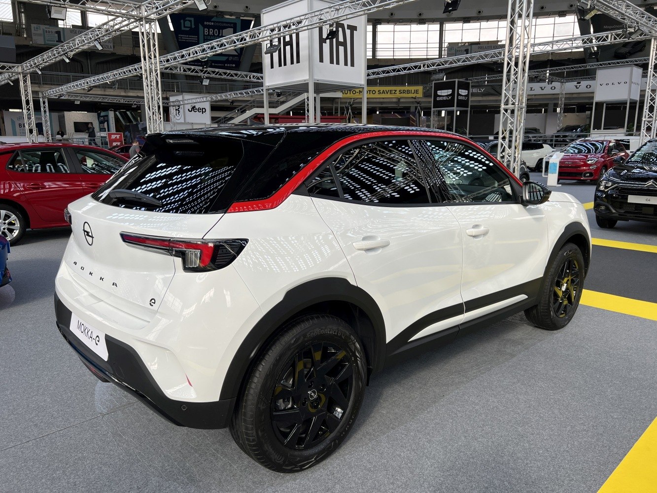 Rear side profile with sleek taillights and black alloy wheels
